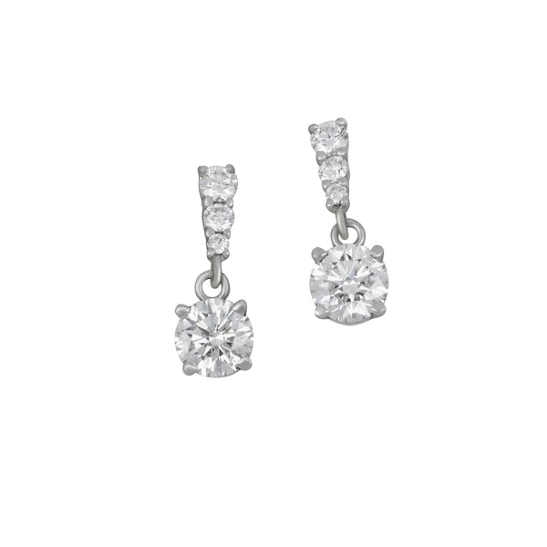 14 karat white gold three graduated one drop Diamond earrings, D=0.73tw