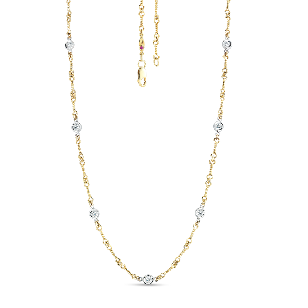 Roberto Coin 18 karat yellow and white gold diamond by the inch 7 station dog bone necklace 16