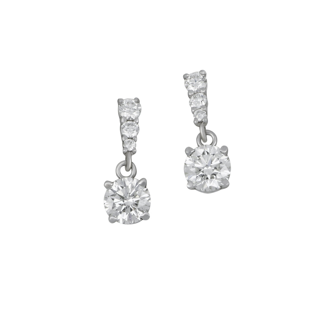 14 karat white gold three graduated one drop Diamond earrings, D=0.73tw